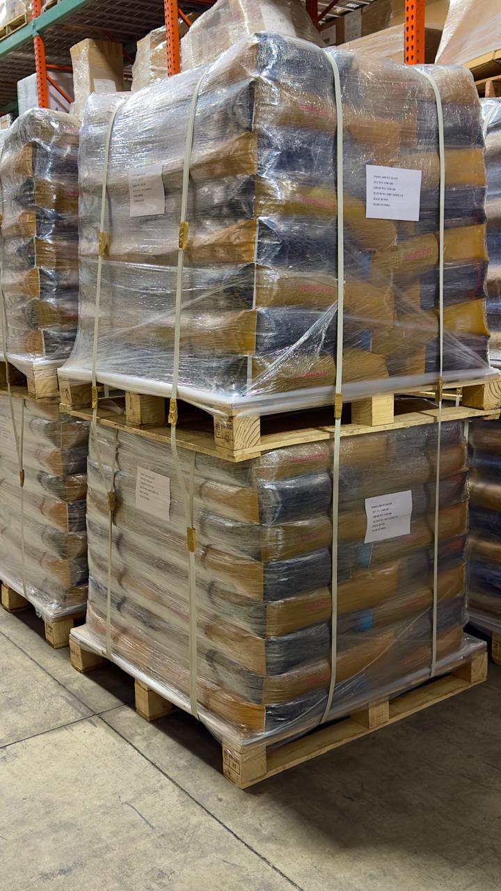 Warehouse pallets of packaged activated carbon prepared for shipment